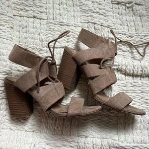 woman’s beige lace up heels